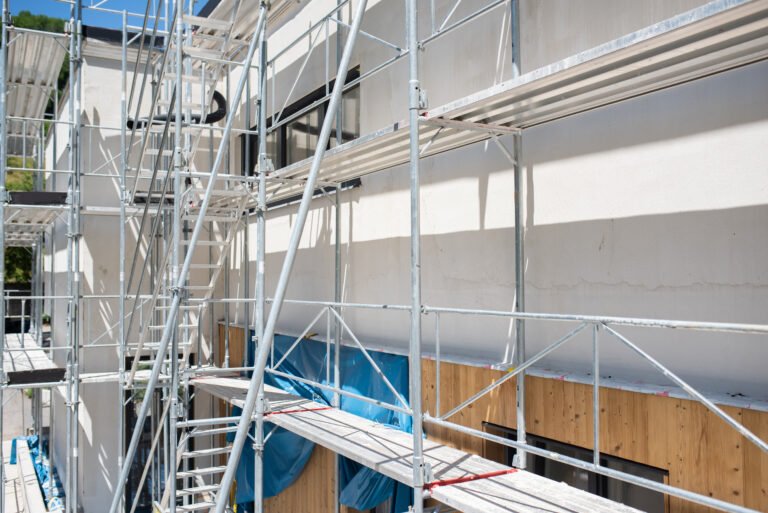 Modern house under construction in a natural environment.